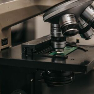 Detailed view of a laboratory microscope, essential for scientific research and analysis.